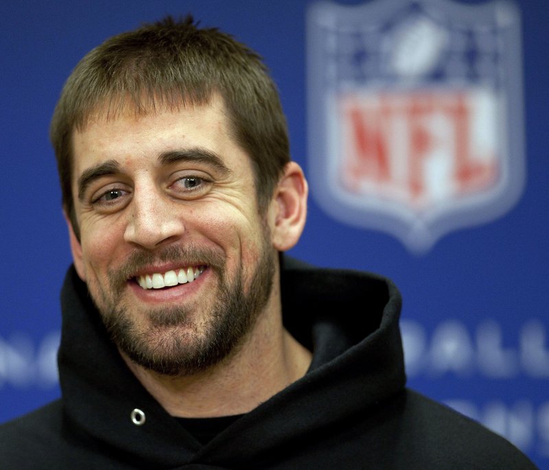 Aaron Rodgers, quarterback for the Green Bay Packers, says the audience was lucky he didn't sing during his brief appearance at a Brad Paisley concert in Green Bay, Wis., on Thursday.