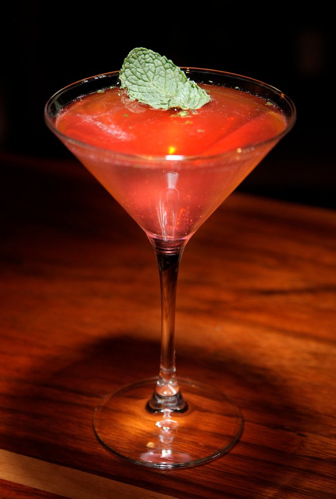 From the bar at District, an Old Cuban, which is made with Bacardi rum, mint, Peychaud's Bitters and Prosecco.