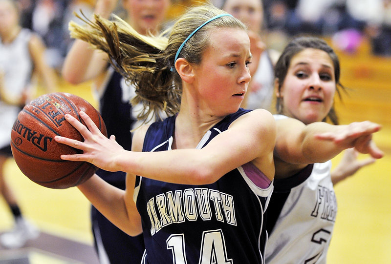Alexa Sullivan of Yarmouth keeps the ball from going out of bounds and holds it away from Alexandra Mitch of Freeport in the second half of their Western Maine Conference game Friday. Freeport earned a 42-31 victory at home.