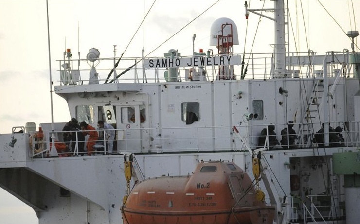 Members of South Korean naval special forces rescue crew members on the South Korean cargo ship Samho Jewelry in the Arabian Sea on Friday. The forces stormed the hijacked freighter, rescuing 21 crew members, killing eight assailants and capturing five in a rare and daring raid on Somali pirates.