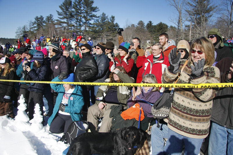 Spectators cheer for polar dippers. Proceeds benefited Animal Hills Animal Shelter.