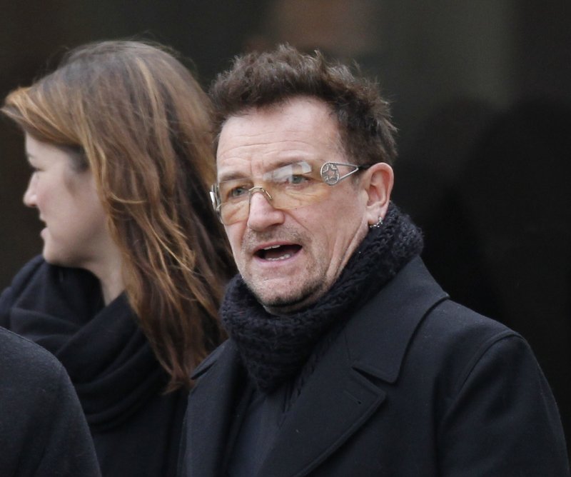 Rock singer Bono leaves following the funeral of R. Sargent Shriver at Our Lady of Mercy Catholic church in Potomac, Md., on Saturday. Bono worked with Shriver’s eldest son.