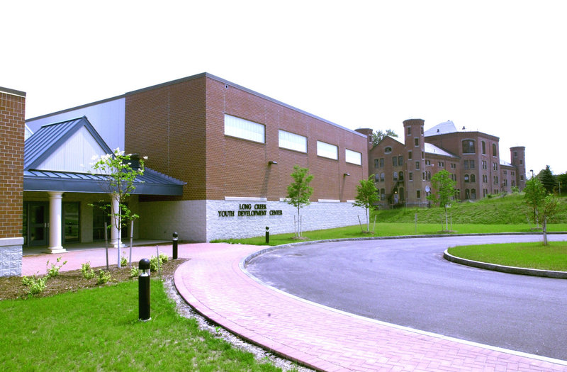 The Long Creek Youth Development Center, left, shown after construction in July 2002. At right is the main building of the former Maine Youth Center.