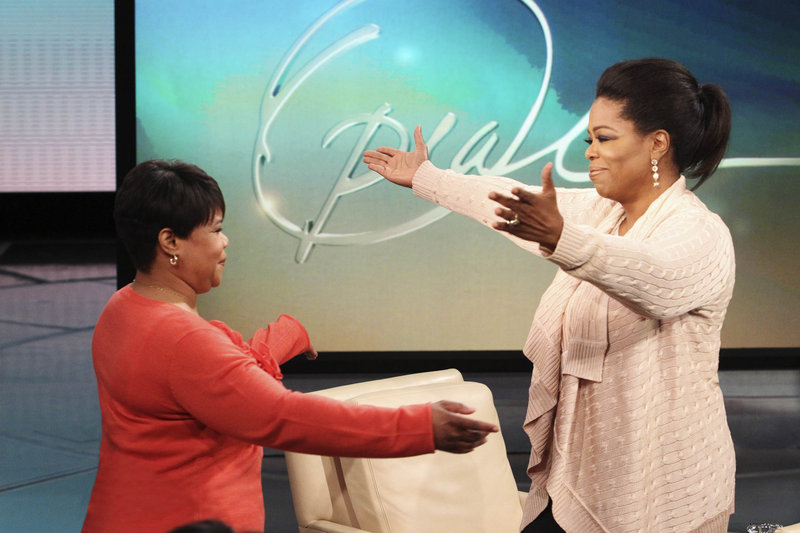 Oprah Winfrey greets her half sister Patricia on Monday’s “The Oprah Winfrey Show.” “She never once thought to sell the story,” Winfrey said.