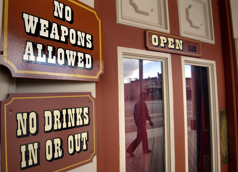 Signs provide reminders for patrons of establishments in downtown Tombstone, Ariz. Tombstone, southeast of Tucson, has had a colorful past, and is perhaps best known for the famous Gunfight at the O.K. Corral on Oct. 26, 1881 that left three men dead. Tombstone was originally founded as a silver mining town.
