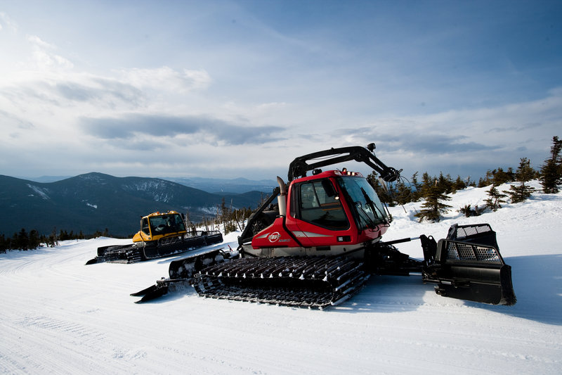 Snow groomers like these modern ones at Sugarloaf have come a long way from the 1960s, when Maine pioneers experimented with new ways to groom the slopes at ski areas.