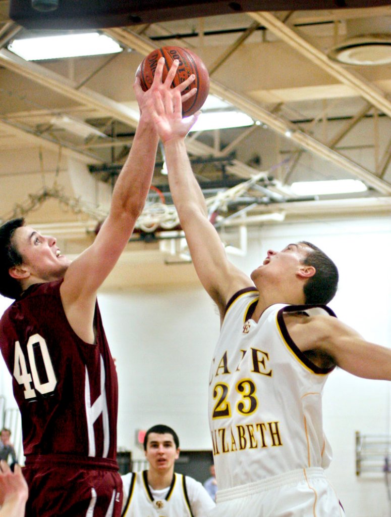 Tanner Storey of Greely, left, competes with Kyle Danielson of Cape Elizabeth for a rebound Tuesday night during Greely's 68-50 victory. The top-ranked Rangers had lost five straight to the Capers.