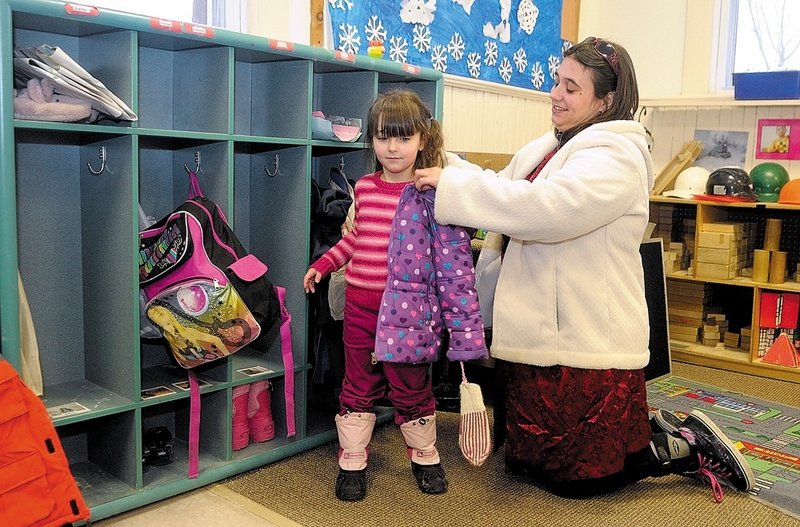 Erica Dupont helps her daughter Alexis Hogy at the Webster Early Care and Education Center on Wednesday in Augusta. She says “it’s time to break the stereotype.”