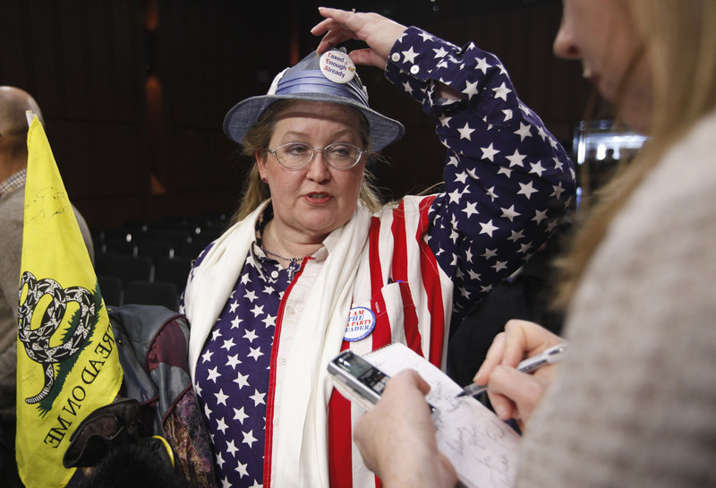 JoAnn Abbott, co-organizer for the Washington, D.C., Tea Party, speaks to reporters at the sparsely-attended Senate Tea Party Caucus on Capitol Hill in Washington on Thursday. The caucus attracted just four senators – out of a possible 47 GOP senators – willing to describe themselves as members.
