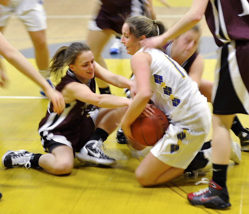 Megan Coale, left, of Greely and Falmouth’s Jackie Doyle battle for a loose ball in the middle of a scrum. The Rangers improved to 11-2 with a 41-34 victory.