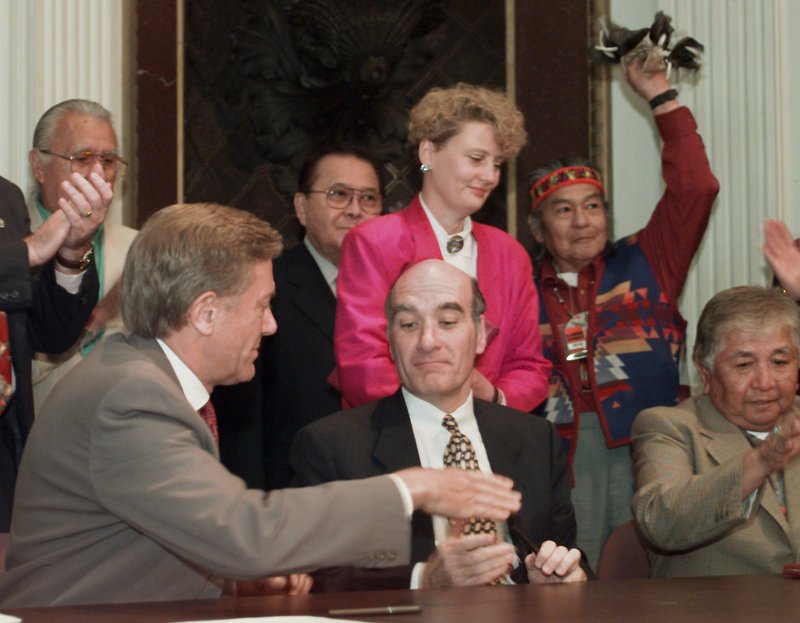 Bruce Babbitt, left, the Interior secretary at the time, reaches to shake hands with then-Commerce Secretary William Daley after signing an agreement in June 1997 in which Indian tribes would protect fish and wildlife on their own lands. Daley, now President Obama’s chief of staff, once observed that because the Commerce Department oversees the National Oceanic and Atmospheric Administration, the commerce secretary “spent 60 percent of his time dealing with fish.” Proposals are afoot to streamline the department.
