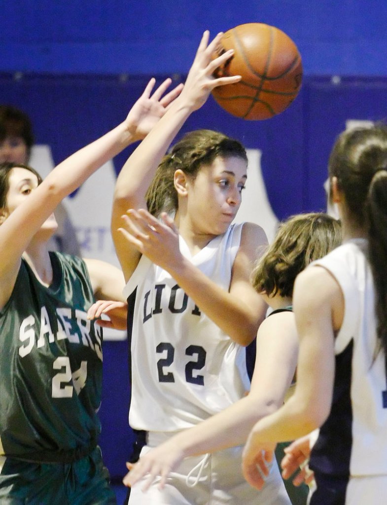 Suzie Gonzalez of Greater Portland Christian finds a teammate Saturday while pressured by Brittany Troxell of Calvary Chapel. Greater Portland Christian won, 50-32.
