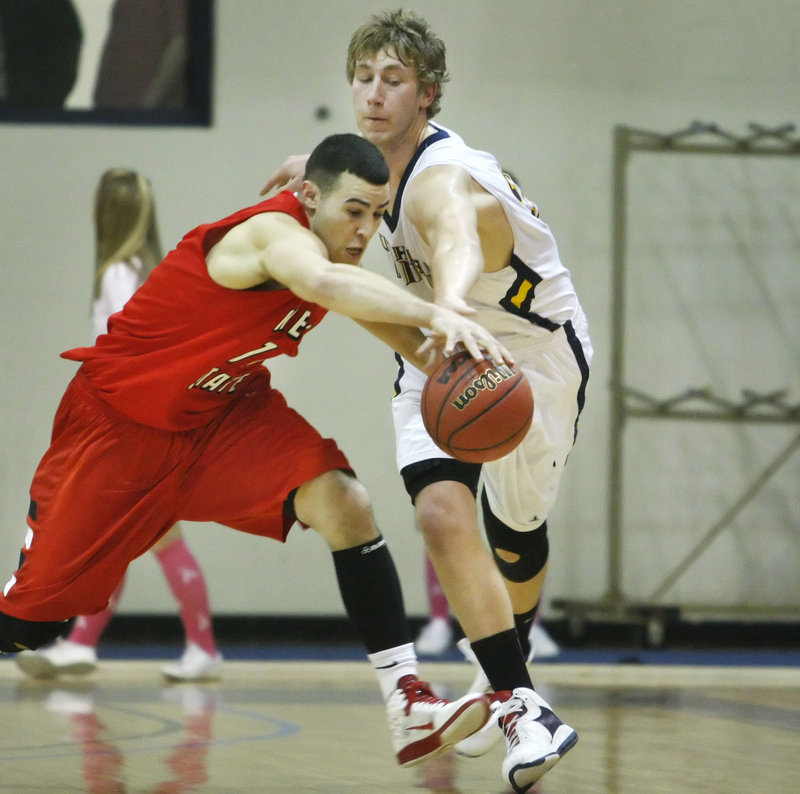Sean Bergeron, right, of USM tries to beat Cody Snow of Keene State to a loose ball. The Owls took the lead for good with 3:44 left in the game.