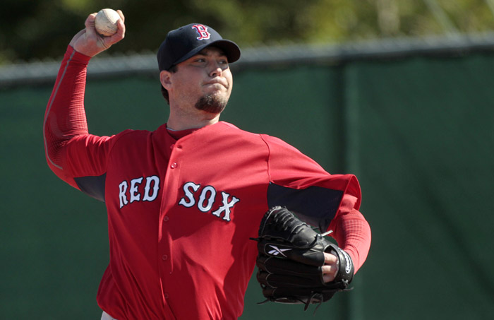 Boston Red Sox pitcher Josh Beckett throws at the Boston Red Sox player development complex in Fort Myers, Fla., today.