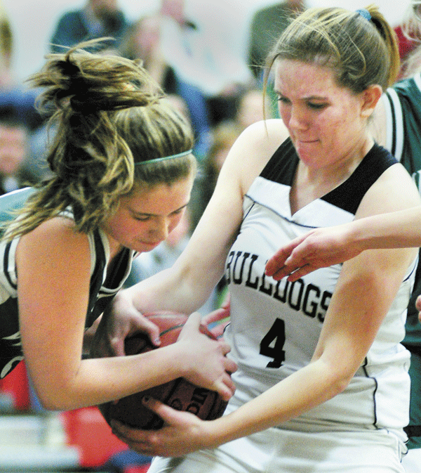 TIE UP: Winthrop’s Randi Dennett, left, and Hall-Dale’s Natasha Brown battle for the ball during their Mountain Valley Conference game Thursday night in Farmingdale.