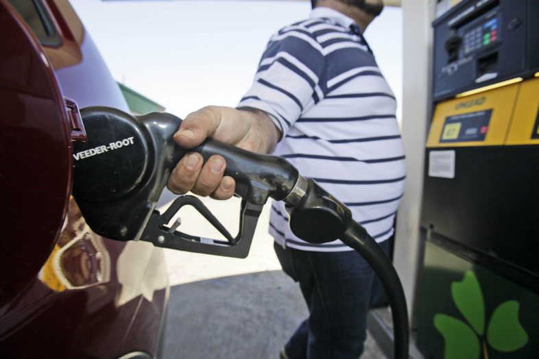 Juan Zuniga gasses up a SUV in Dallas on Thursday. Gasoline prices rose more than 2 cents on Thursday to a new national average of $3.228 per gallon.