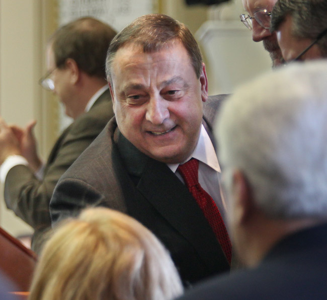 Gov. Paul LePage greets lawmakers as he prepares to announce his two-year state budget today in Augusta.