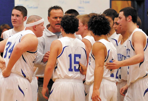 HERE WE GO: Lawrence head coach Mike McGee talks with his players during a timeout against Messalonskee earlier this season. The fifth-ranked Bulldogs face No. 4 Mt. Blue in a quarterfinal game at 8 p.m. Saturday at the Augusta Civic Center.
