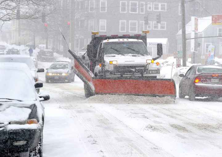Plows are out today in Portland – seen here on Cumberland Avenue – trying to clear streets ahead of a heavy snow predicted to begin early Wednesday morning.