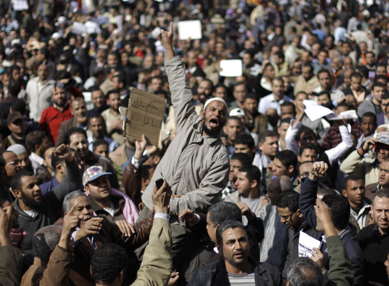 Demonstrators vent their anger Monday in Cairo. A coalition of opposition groups called for one million people to take to the streets today to pressure President Hosni Mubarak to leave.