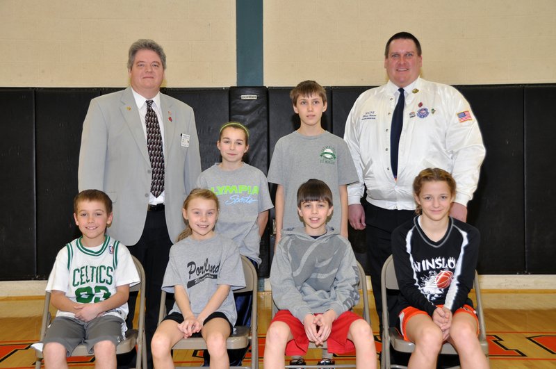 The Maine Elks Association’s State Hoop Shoot champions were determined Sunday at Brunswick High School. The age-group winners were: Front, Henry Westphal (8-9 boys), Isabel Dawson (8-9 girls), Colby Esty (10-11 boys), Ciara LeClair (10-11 girls); Back, Caitlin Paradis (12-13 girls) and Stephan Gikas (12-13 boys), with MEA State President Roger Normandeau, back left, and State Hoop Shoot Director Mark Inman.