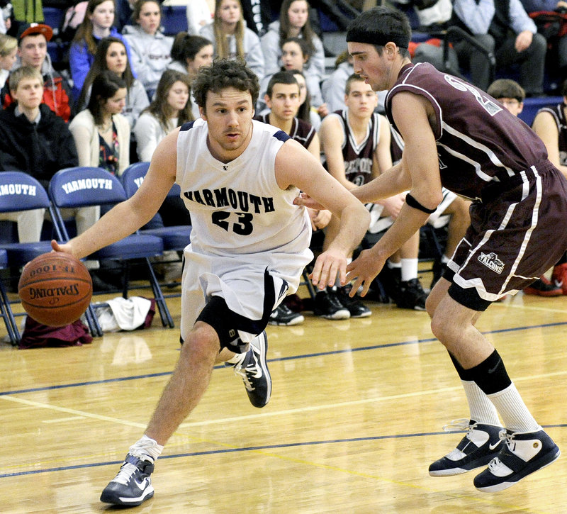 Mike McCormack of Yarmouth looks for room around Adam Higgins of Freeport during their Western Maine Conference game Tuesday. The Clippers improved to 12-3 with a 77-16 victory at home.