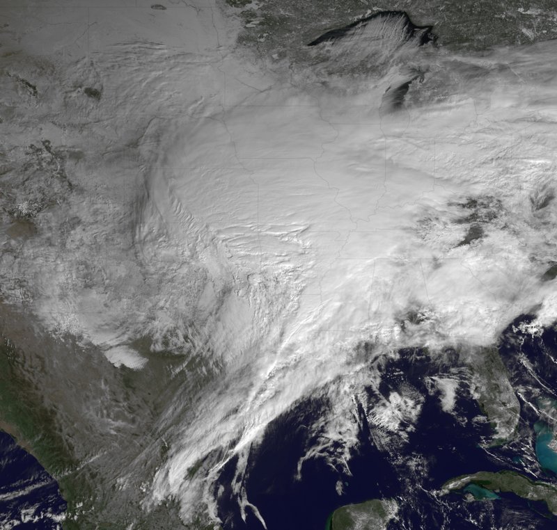 The Associated Press A NOAA satellite photo shows most of the U.S. under cloud cover from the winter storm moving across the U.S. Tuesday. The system stretched more than 2,000 miles.
