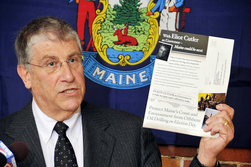 Independent gubernatorial candidate Eliot Cutler, shown in an Oct. 25, 2010, photo, holds a mailer that he cited as an example of negative campaigning.