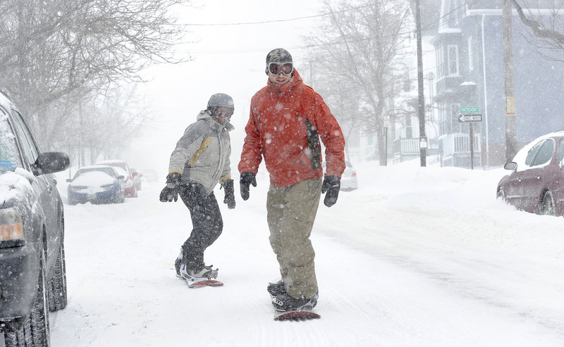 No plows were desired by two hardy boarders Wednesday, as Steve Bailey of Windham and James MacKenzie cruise down Congress Street in Portland during the height of the snowstorm.