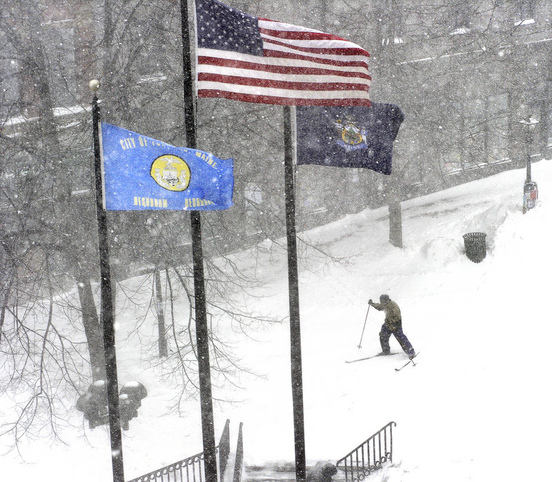 Cross-country skis were a logical form of transportation Wednesday as the snow piled up in Portland’s Monument Square.