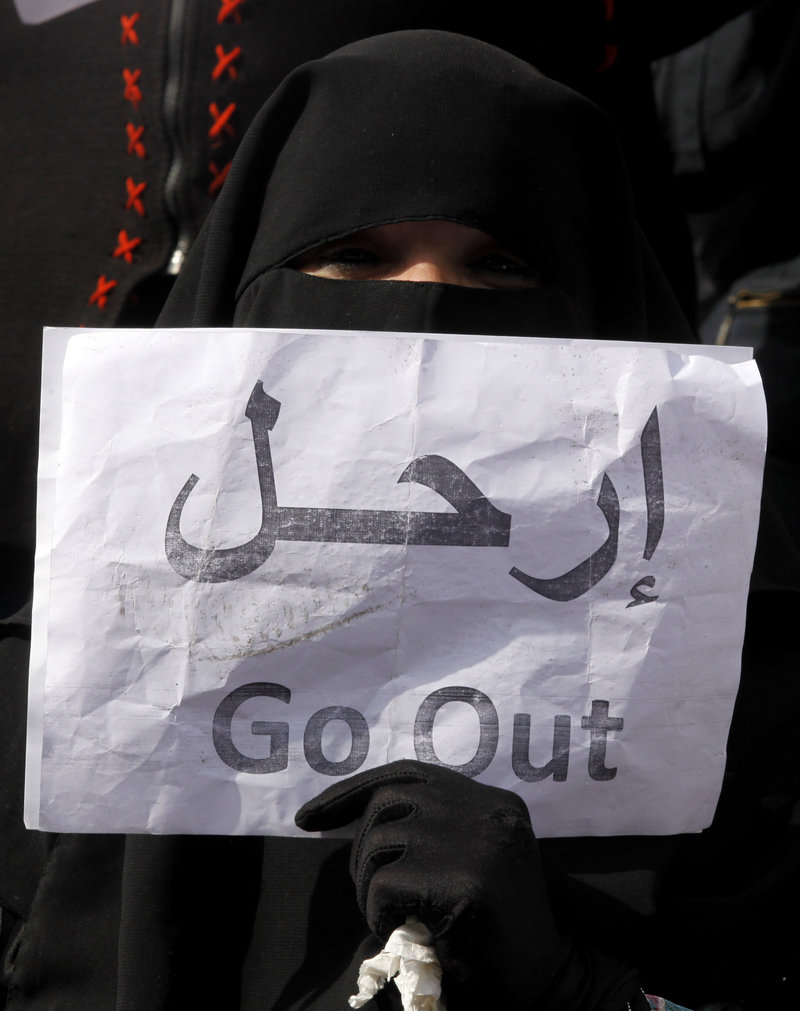 A woman wearing a veil participates in an anti-government demonstration in Cairo, Egypt, on Tuesday. The Muslim Brotherhood advocates strict adherence to religious traditions such as veils but claim they are not interested in dominating Egypt if President Hosni Mubarak is driven out.