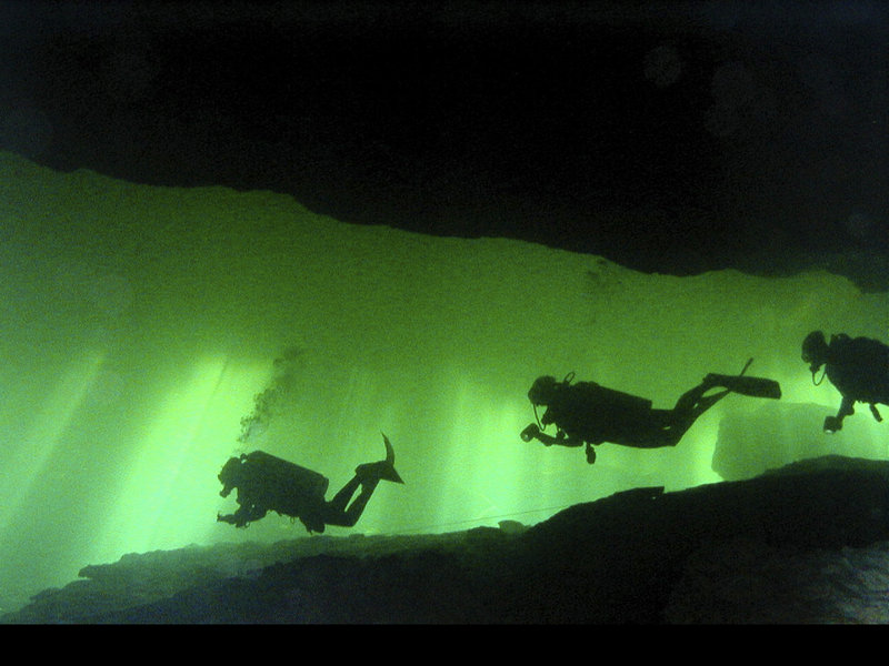 Cave divers make their way though an underwater cave. Interest in the sport has increased recently with this weekend s release of "Sanctum," an action-thriller movie from executive producer James Cameron.