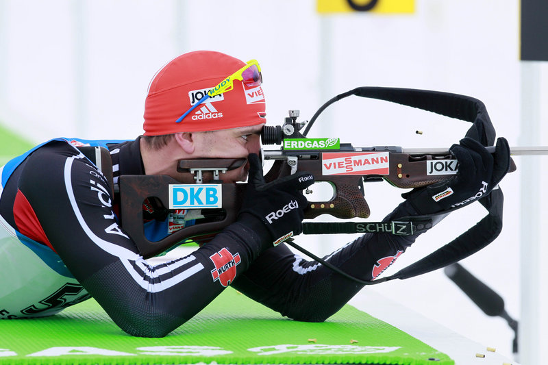 Arnd Peiffer of Germany takes aim from the prone position on his way to winning the men’s 10-kilometer sprint at the World Cup biathlon competition Friday at Presque Isle.