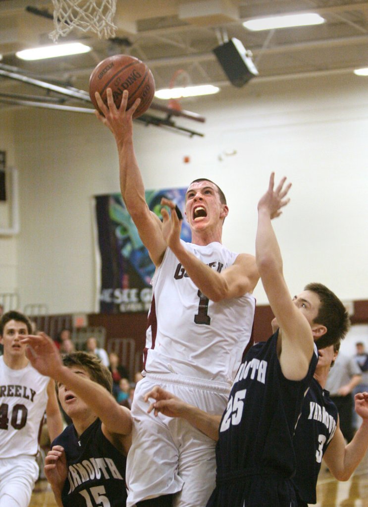 Sam Johnston of Greely heads to the basket Friday night while finding room between Matt Murphy, left, and Sam Torres during Yarmouth s 53-51 victory in Cumberland.