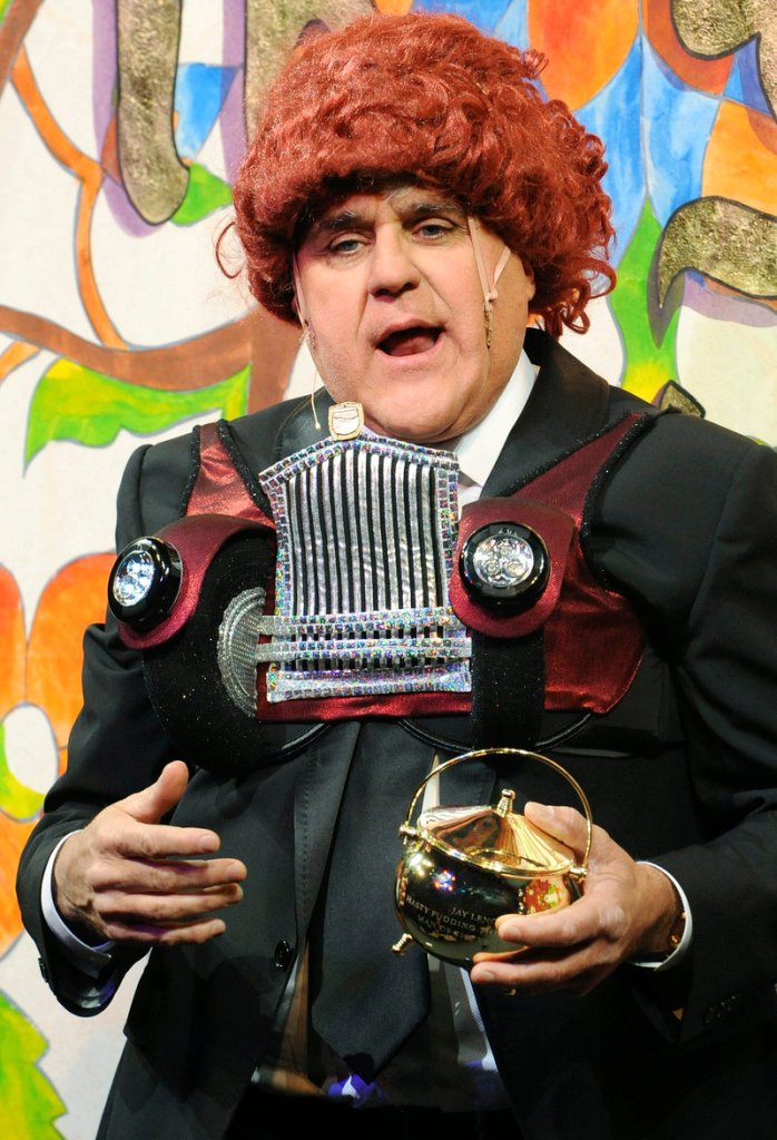 Jay Leno, host of "Tonight," holds the Hasty Pudding pot and chats with the audience Friday after he was honored as the 2011 Man of the Year at Harvard University.