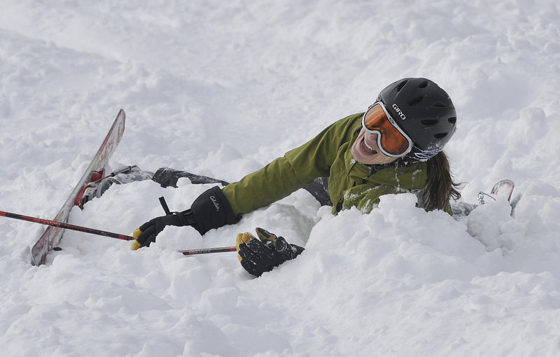 Is there a "do not fall" list for telemarkers? Amy Wallace of Portland is all smiles after she collapsed at the end of the mogul competition during The Maine Telemark Festival Saturday.