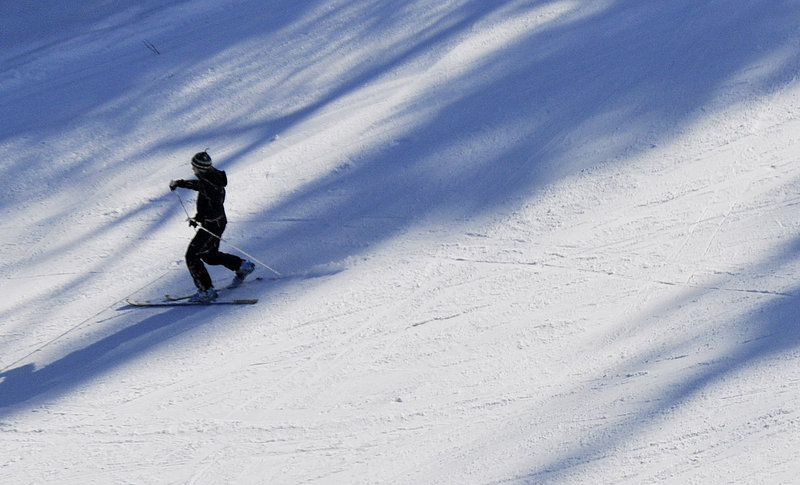 A telemark skier descends a trail during the festival. A festival organizer, Biff Higgison, says telemark "takes skiing to almost a movement of dance coming down the slope."
