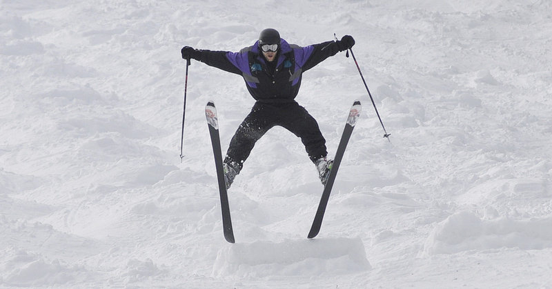 Andy Gale of Cambridge, Mass., does a spread eagle during the mogul competition at The Maine Telemark Festival at Sunday River in Newry on Saturday.
