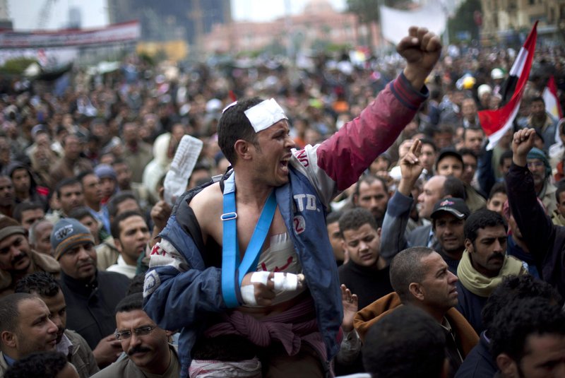 Egyptian anti-Mubarak protesters shout slogans during a demonstration in Tahrir Square in Cairo, Egypt, on Saturday.