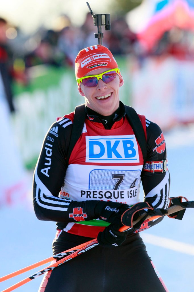 Germany’s Daniel Bohm relaxes after crossing the finish line Saturday to win the mixed relay race at the Biathlon World Cup in Presque Isle. The U.S. team placed seventh.