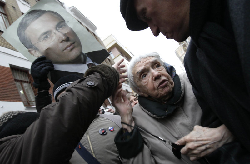 Human rights activist Lyudmila Alexeyeva and other supporters of Mikhail Khodorkovsky gather in Moscow Dec. 27, before the former oil tycoon was sentenced to prison for money laundering. Alexeyeva earlier called on U.S. officials to question the presence in the United States of Ashot Egiazaryan, but she said Sunday that she is now unsure of the facts behind her criticism of him.