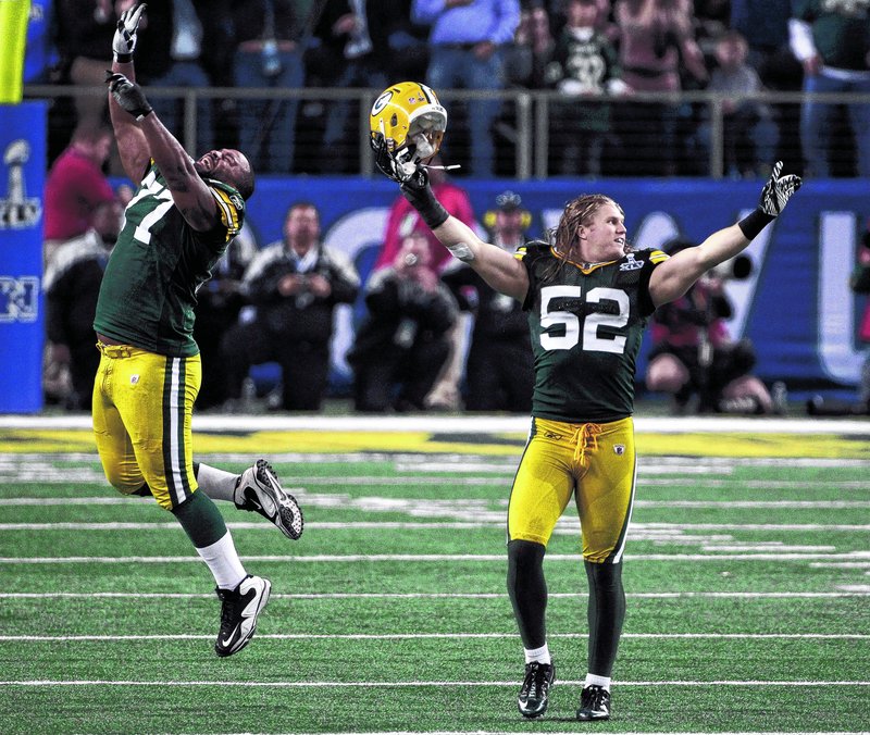 Green Bay’s Cullen Jenkins, left, and Clay Matthews celebrate after a late defensive stand clinched a 31-25 win over Pittsburgh in the Super Bowl on Sunday night in Arlington, Texas. Green Bay won the NFL title for a record 13th time – its fourth of the Super Bowl era and its first in 14 years.