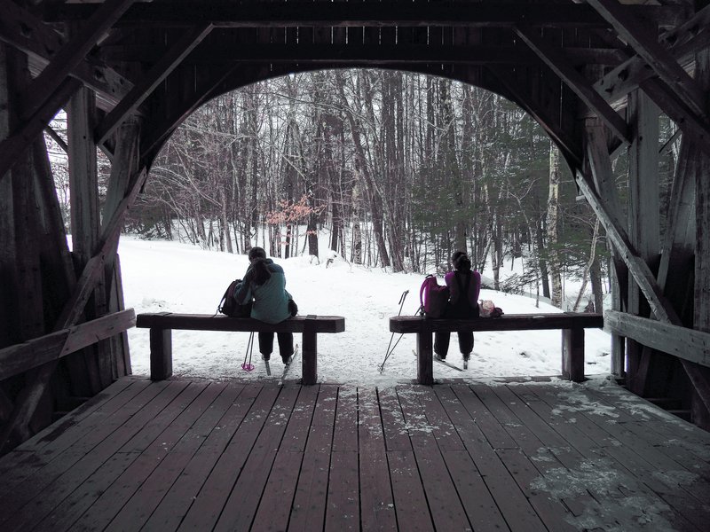 The Artists’ Covered Bridge offers a picturesque place to stop while cross-country skiing at Sunday River in Newry.