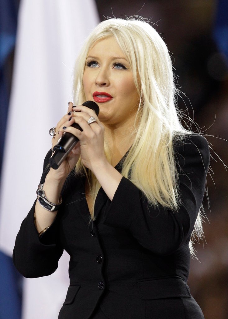 Christina Aguilera sings the national anthem before the Super Bowl game between Green Bay and Pittsburgh on Sunday in Arlington, Texas.