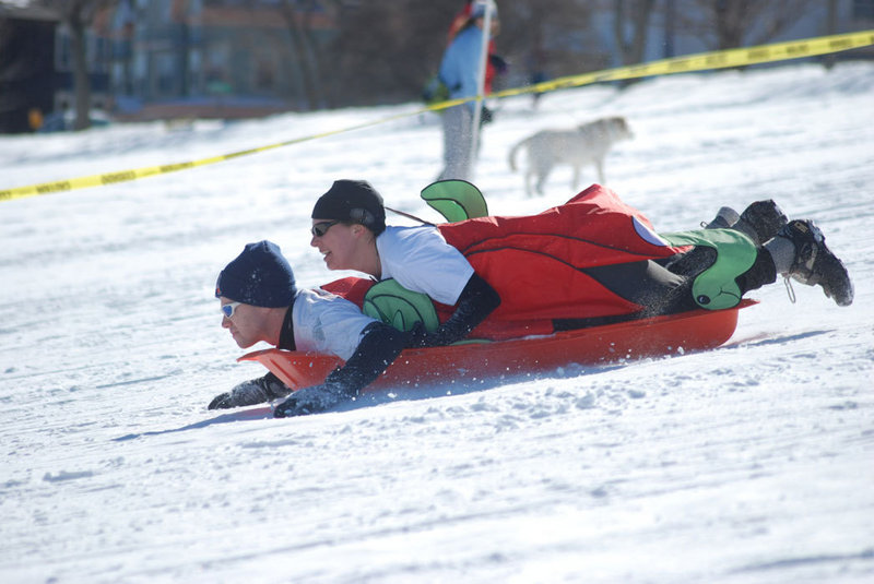 Costumed teammates sled to the finish on the Eastern Promenade in the 2009 Snowman Adventure Race. This year’s biking, running and sledding relay is on Saturday.
