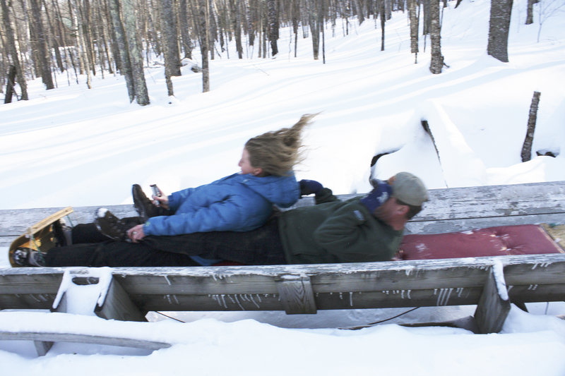 Shannon Bryan teams up with Bruce Richards for a toboggan ride at the Camden Snow Bowl.