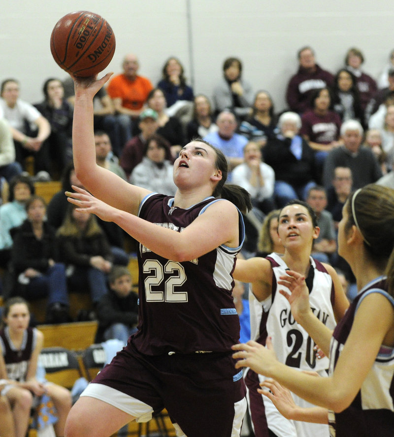Gina Cirillo of Windham gets past Gorham's Natalie Egbert for a layup Tuesday night at Gorham. Gorham rode a strong second half to a 58-43 victory.