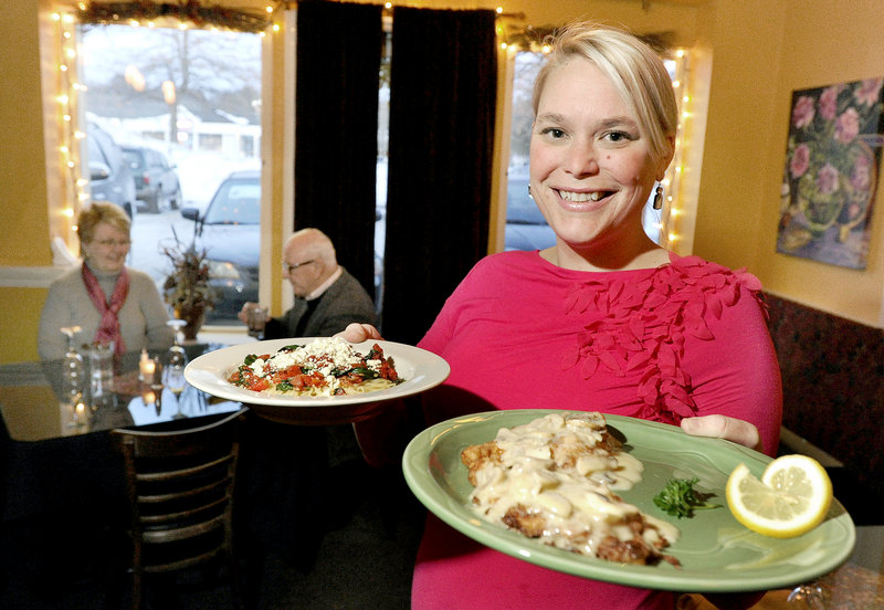 Meg McKissock serves Amatriciana and chicken limone at Hug’s Italian Restaurant in Falmouth. Many of Hug’s dishes hold cream sauces, one reason for the business’s popularity.