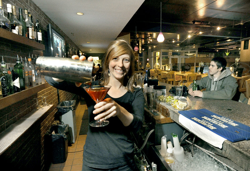 Bartender Angela Haven gets to work at Old Port Sea Grill.