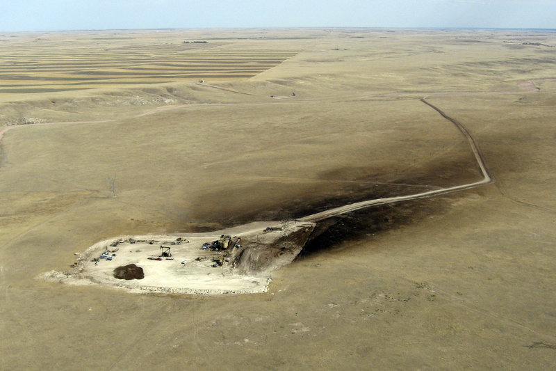 This aerial photo from last fall shows oil sprayed over 15 acres downwind of a runaway oil well owned by SM Energy Co. The well, 12 miles east of Cheyenne, Wyo., was among the first drilled in a rush to tap the Niobrara shale underlying Colorado, Wyoming and Nebraska.